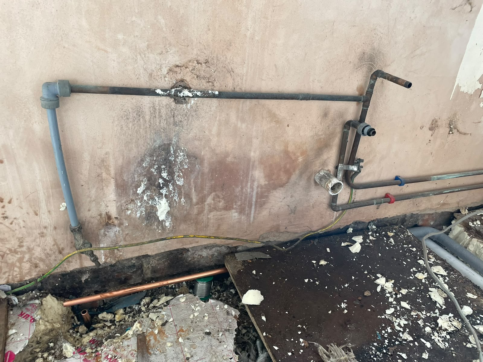 Floor lifted to expose the leaking gas pipe, repaired in new copper