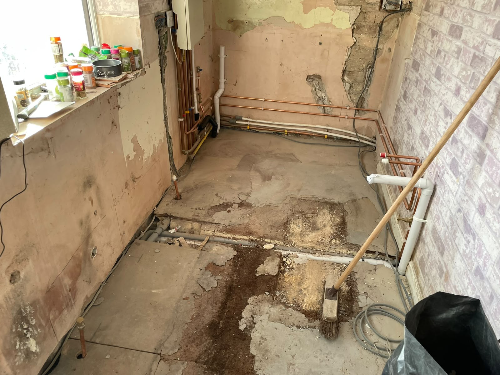 Newcastle kitchen stripped back with new copper hot and cold runs and waste pipework at first fix stage