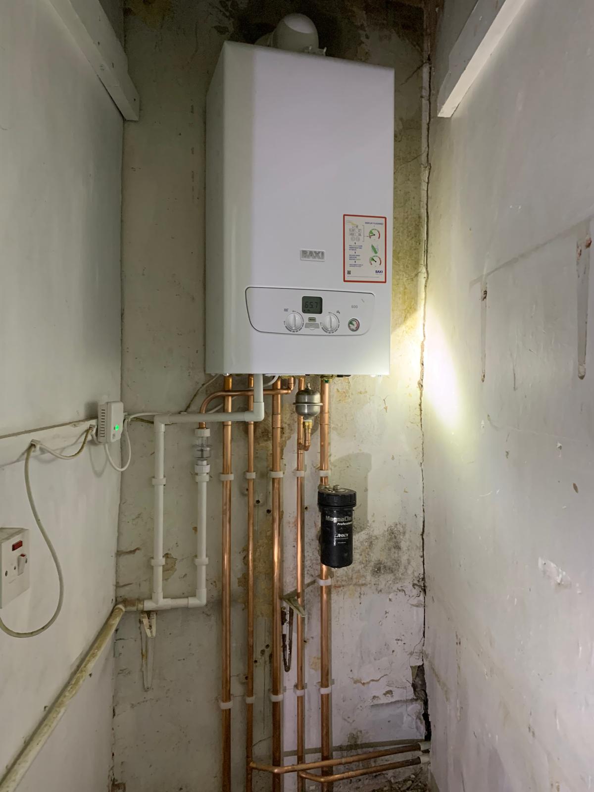 New Baxi combi boiler with neat copper pipework, magnetic filter and isolation valves