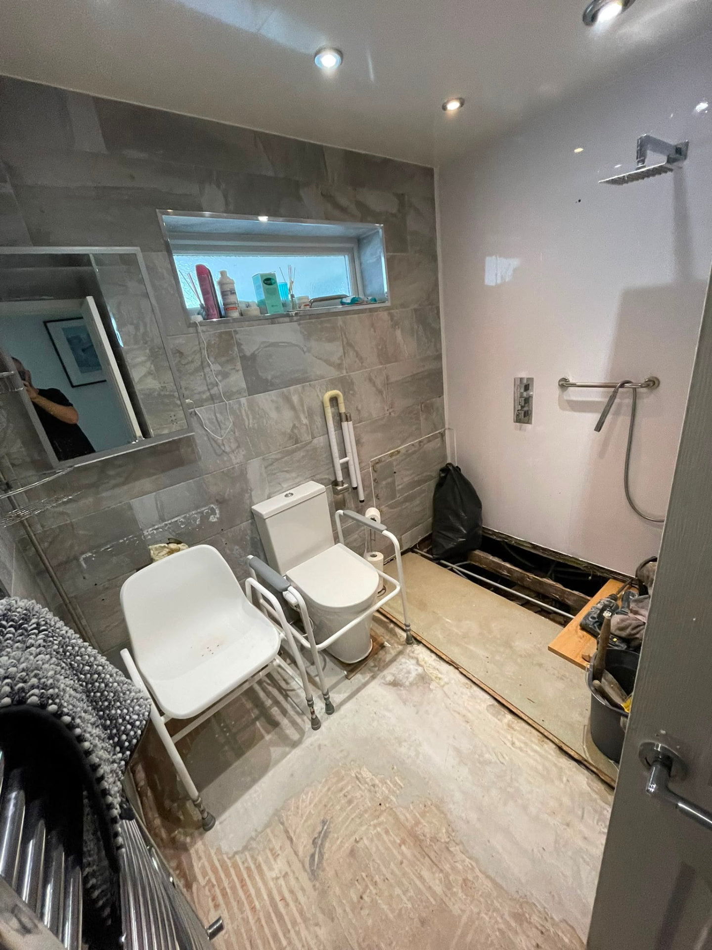 Grey clad shower room part way through the refit with new shower valve fitted