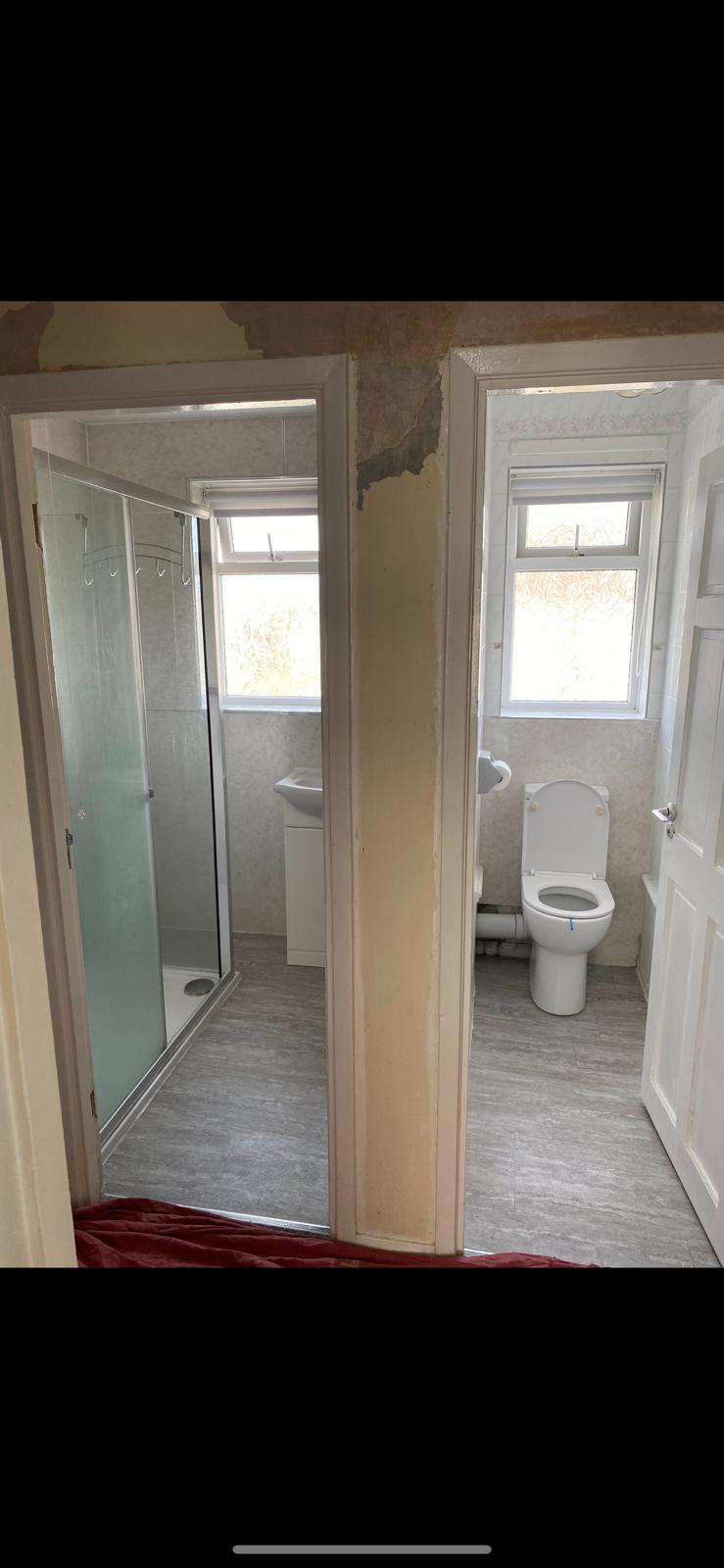 Two small rooms either side of a stud wall, a shower room on the left and a separate WC on the right