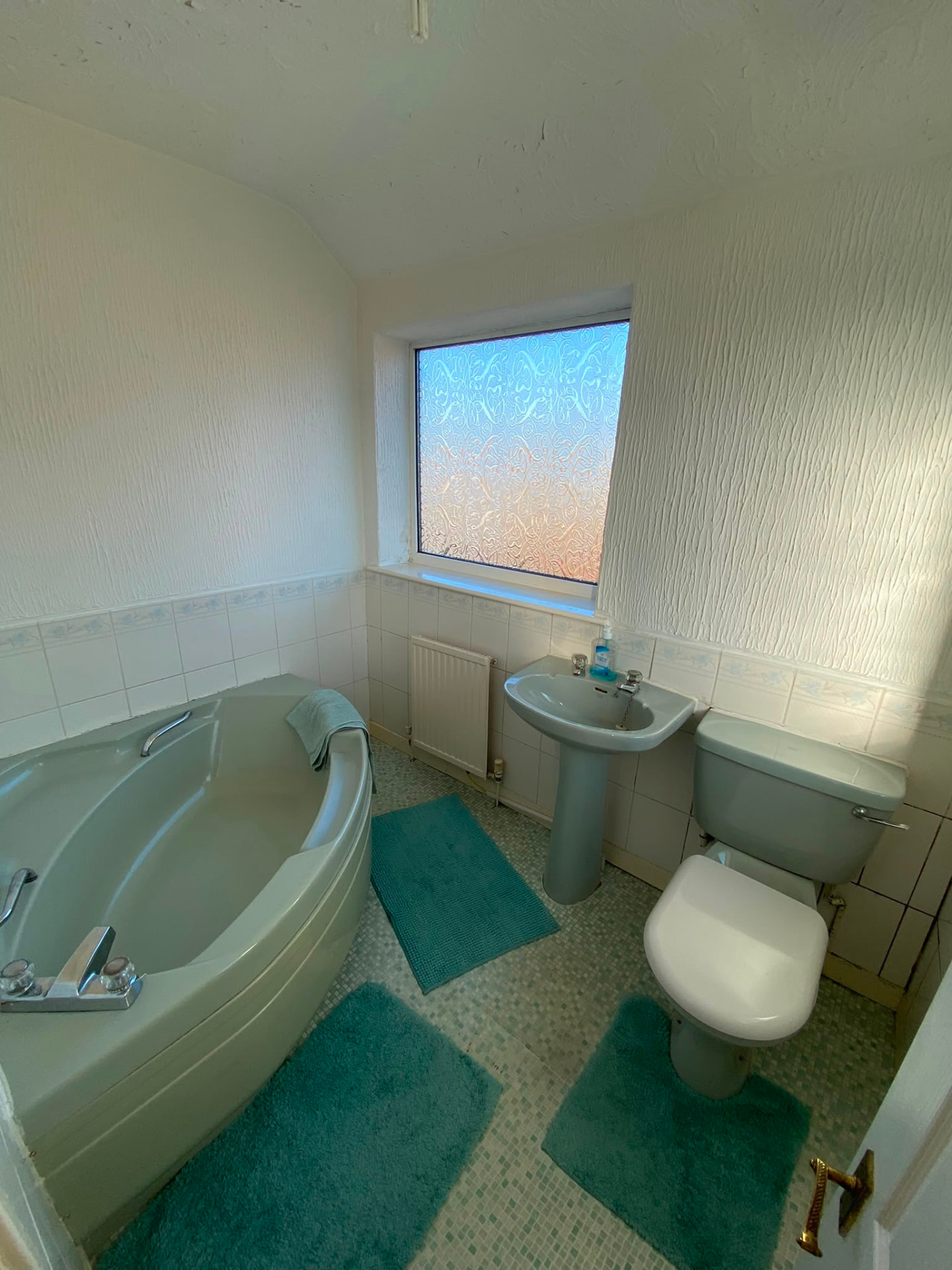 Another view of the dated green bathroom suite before the replacement in Bedlington Station